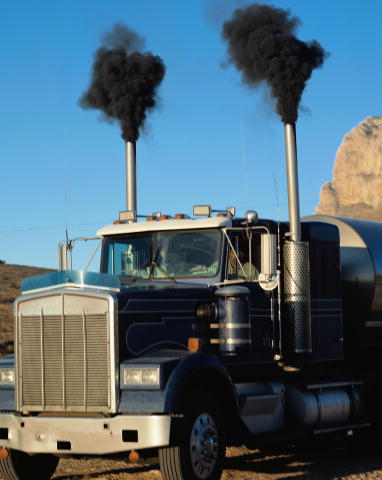Diesel truck with diesel smoke, which contains black carbon, being emitted. 