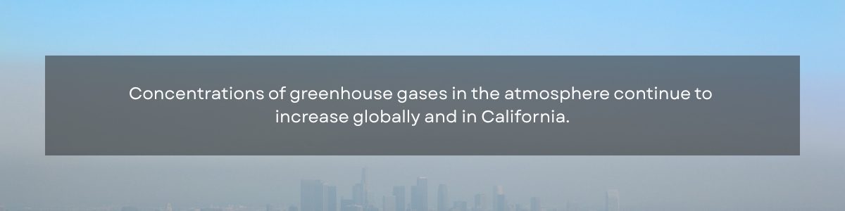 Hazy city skyline in the back with text in the foreground that says "Concentrations of greenhouse gases in the atmosphere continue to increase globally and in California."
