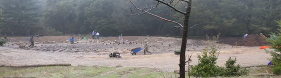 Figure 2. Tribal members propagating plants